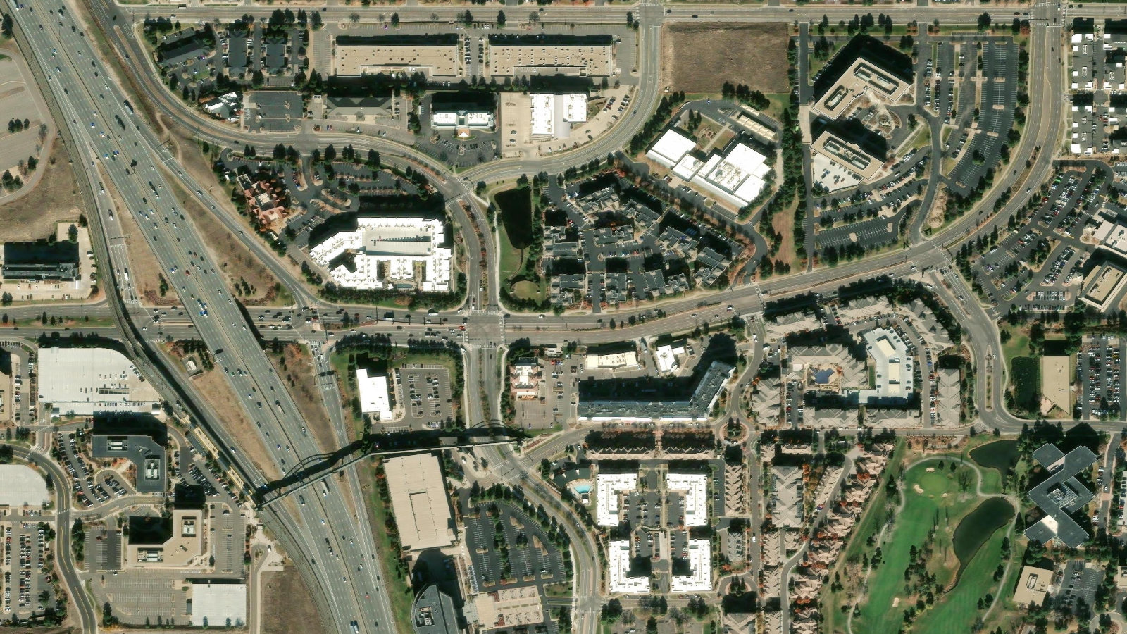Satellite view of an office-park corridor south of Denver, cut by an interstate highway, in Englewood, Colorado.