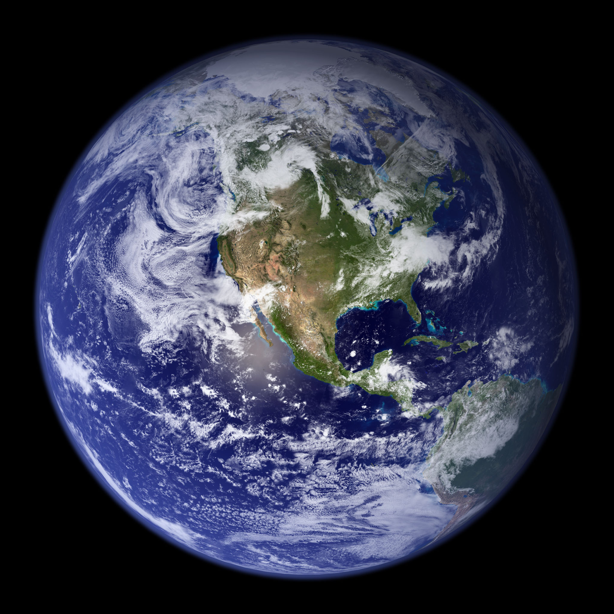 The full disk of Earth from space, the Americas facing the sun.